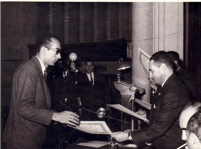 An award being presented to ElBishbishy at a formal ceremony