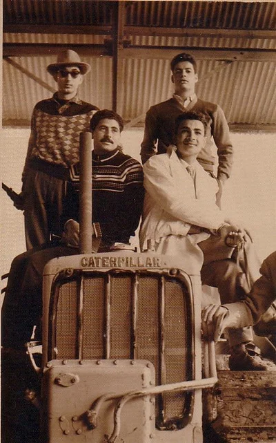 The ElBishbishy family photographed on a Caterpillar tractor in the early years of the farm