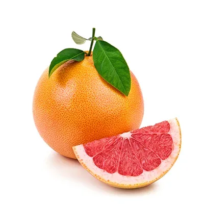 A whole grapefruit beside a cut segment