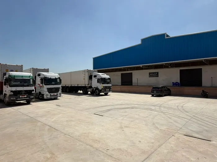 Refrigerated trucks at the loading bay of the ElBishbishy facility
